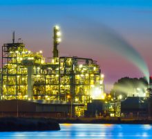 Detail of a heavy Industrial Chemical area with vibrant surreal mystical colors and lights in twilight